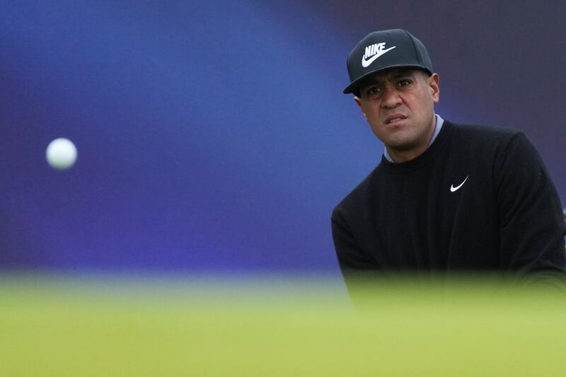 Tony Finau chips onto the 17th green during his opening round of the British Open Golf Championships at Royal Troon golf club in Troon, Scotland, Thursday, July 18, 2024. (AP Photo/Jon Super)