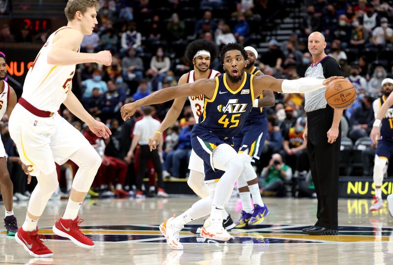 Utah Jazz guard Donovan Mitchell (45) steals the tip as the Utah Jazz and the Cleveland Cavaliers play an NBA basketball game at Vivint Arena in Salt Lake City on Wednesday, Jan. 12, 2022.