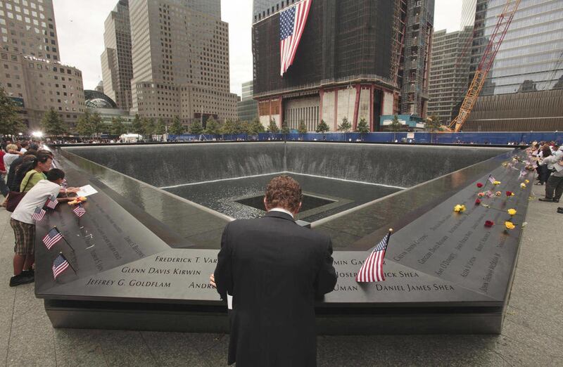 Michael Lehrman, Executive Managing Director of Cantor Fitzgerld and Co., bows his head at the names of some of the over 600 employees from Cantor Fitzgerald who lost their lives in the 2001 terrorist attacks, Sunday, Sept. 11, 2011. Sunday marked the 10t