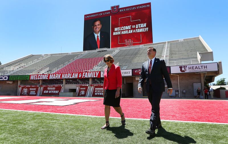 University of Utah President Ruth Watkins and new Athletic Director Mark Harlan walk onto the football field at Rice-Eccles Stadium on Monday, June 4, 2018.