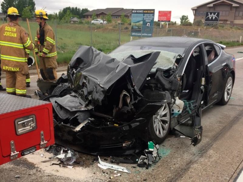 FILE - In this May 11, 2018, file photo, released by the South Jordan Police Department shows a traffic collision involving a Tesla Model S sedan with a fire department mechanic truck stopped at a red light in South Jordan, Utah. Heather Lommatzsch, the U