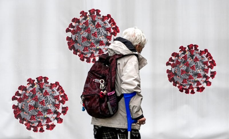 A woman passes a coronavirus test center in Duisburg, Germany.