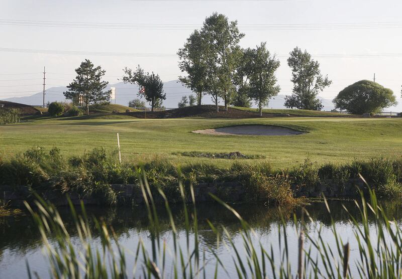 Looking across one of two water hazards at hole 10 at East Bay Golf Course in Provo.