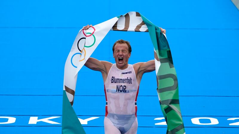 Kristian Blummenfelt of Norway reacts after crossing the finish line to win the gold medal during the men’s individual triathlon at the 2020 Summer Olympics, Monday, July 26, 2021, in Tokyo, Japan. (AP Photo/David Goldman)