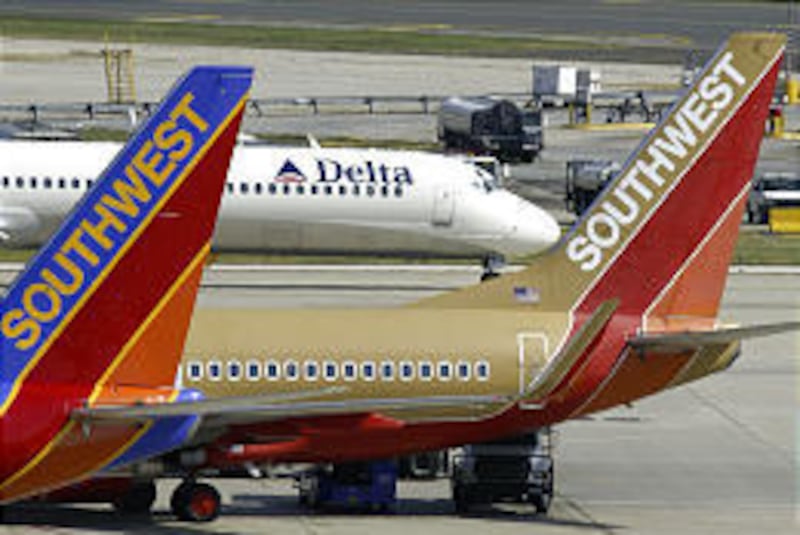 Southwest Airlines jetliners sit at Philadelphia International. Southwest bid Friday for ATA Airlines gates in Chicago.