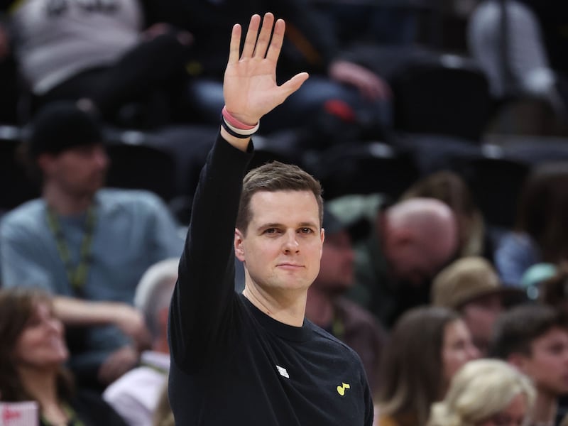 Utah Jazz coach Will Hardy waves to a fan near the end of the game in Salt Lake City on Friday, March 24, 2023.