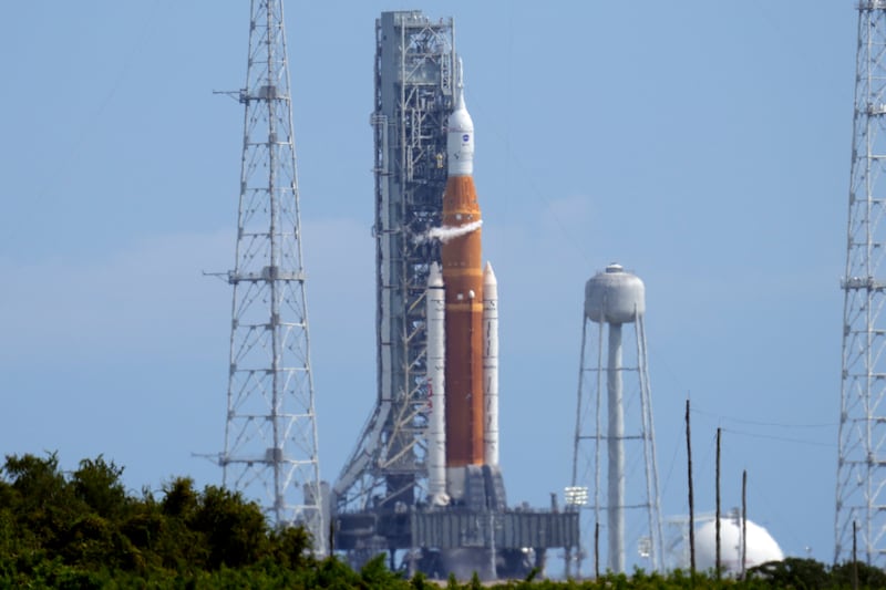 NASA’s new moon rocket sits on Launch Pad 39-B moments after the launch was scrubbed at the Kennedy Space Center Saturday.