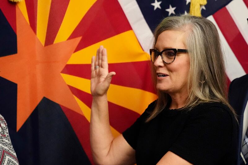 New Arizona Gov. Katie Hobbs takes the oath of office in a ceremony at the state Capitol in Phoenix, Monday, Jan. 2, 2023.