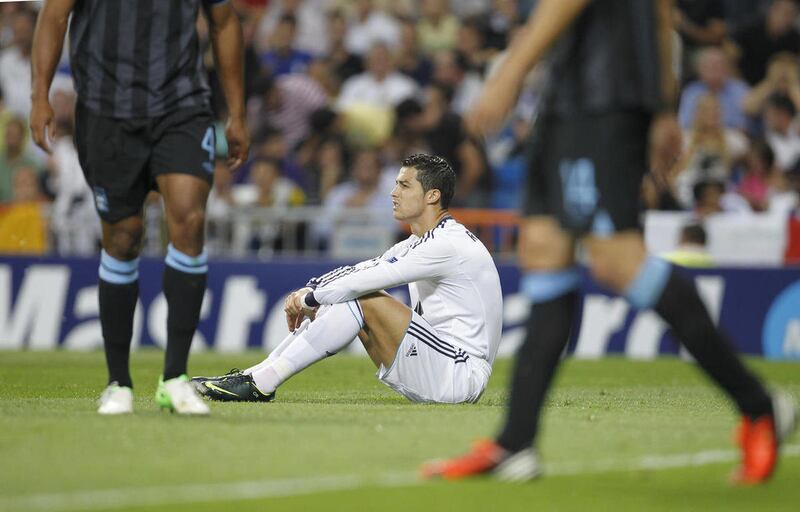 Real Madrid's Cristiano Ronaldo from Portugal reacts during a Group D Champions League soccer match against Manchester City at the Santiago Bernabeu stadium in Madrid Tuesday Sept. 18, 2012.