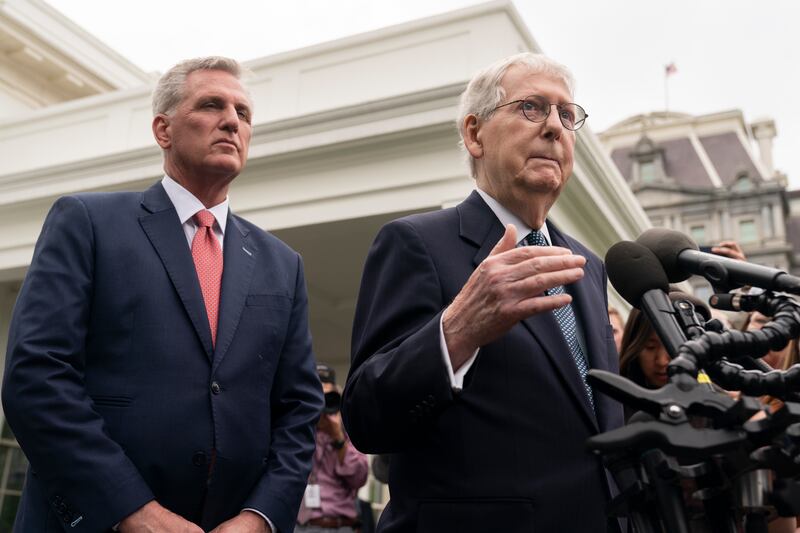 Senate Minority Leader Mitch McConnell of Kentucky and House Speaker Kevin McCarthy of California talk to reporters