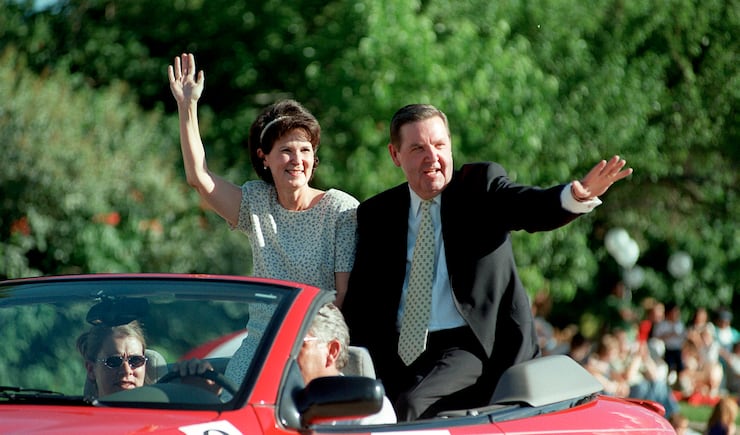 Elder Jeffrey R. Holland, of the Quorum of the Twelve Apostles of The Church of Jesus Christ of Latter-day Saints, and wife, Sister Patricia Holland, ride as grand marshall at the Bountiful Handcart Days Parade on July 23, 1999.