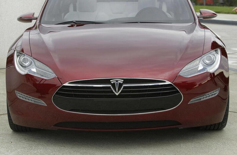 In this Oct. 27, 2010, file photo, the Tesla Model S electric sedan is shown during the unveiling of the new Tesla factory in Fremont, Calif.