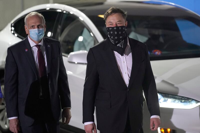 NASA acting administrator Steve Jurczyk and SpaceX founder and CEO Elon Musk arrive for the walkout of the SpaceX crew.