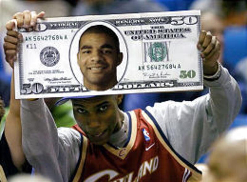A Cavaliers fan demonstrates his feelings toward Jazz forward Carlos Boozer before Tuesday's game.