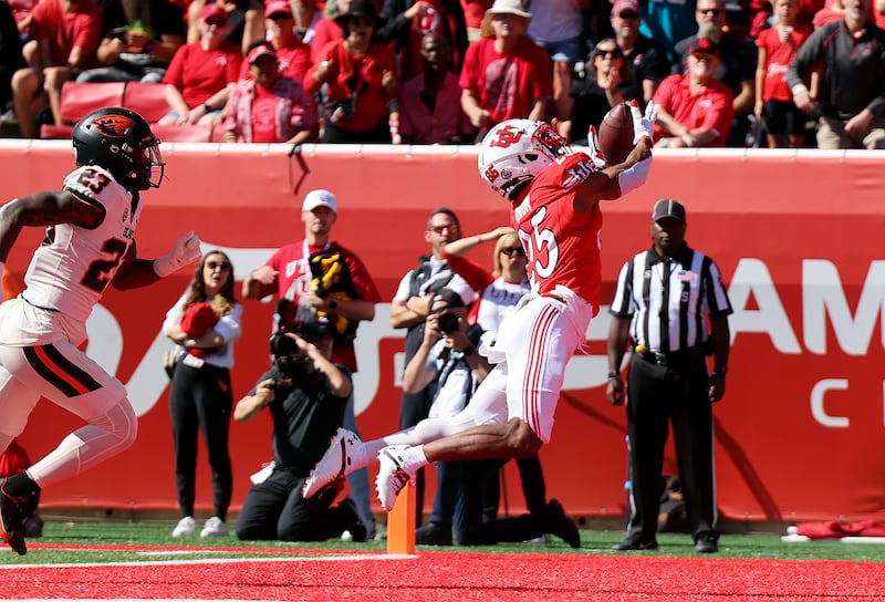 Utah Utes wide receiver Jaylen Dixon stretches out for the football
