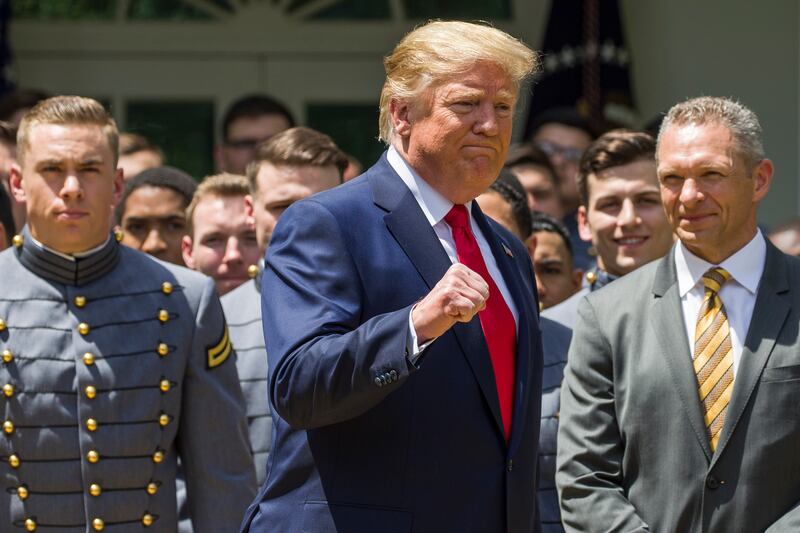 President Donald Trump pumps his fist as he departs after the presentation of the Commander-in-Chief's Trophy to the U.S. Military Academy at West Point football team, in the Rose Garden of the White House, Monday, May 6, 2019, in Washington. (AP Photo/Al