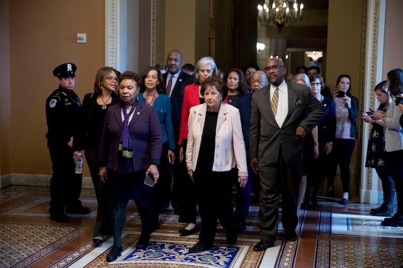 Democratic House members including Rep. Barbara Lee, D-Calif., third from left, and Rep. Nita Lowey, D-N.Y., center, and Rep. Gregory Meeks, D-N.Y., right, walk to the Senate Chamber to observe votes on two bills to end the partial government shutdown on