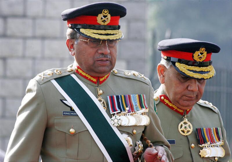 Pakistani President Pervez Musharraf, left, walks with Gen. Tariq Majid during his farewell visit in Rawalpindi Tuesday. His rule will be strictly civilian.