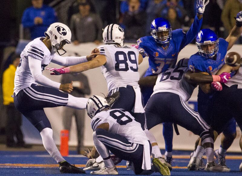 Brigham Young placekicker Rhett Almond (26) attempts a field goal during an NCAA football game between Boise State and Brigham Young in Boise on Thursday, Oct. 20, 2016. Boise State defeated Brigham Young 28-27 in a wild game.