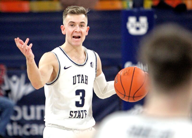 Utah State guard Steven Ashworth gets the Aggies into their offense during a win over Wyoming on March 4, 2021, in Logan.