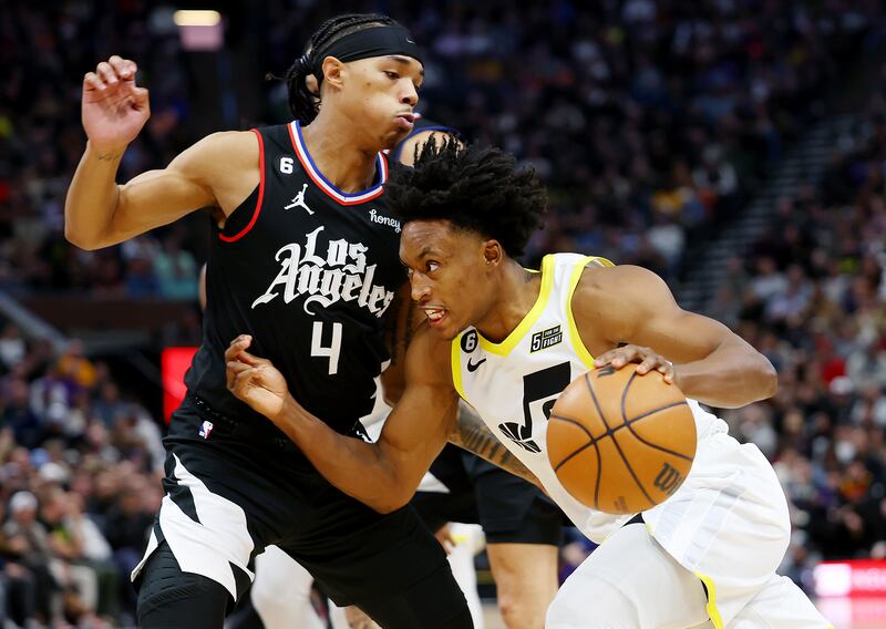 Utah Jazz guard Collin Sexton (2) drives on Los Angeles Clippers guard Brandon Boston Jr. (4) as the Jazz and the Clippers play.