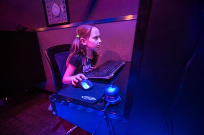 Dagny Thomas, 6, plays the computer inside a simulator at Central Elementary School in Pleasant Grove on Monday, Dec. 17, 2018.