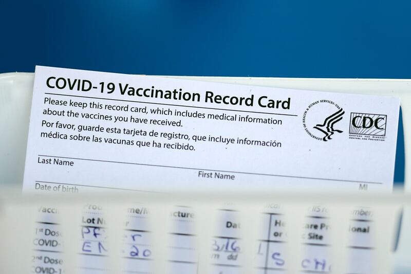 A vaccination record card is shown during a COVID-19 vaccination drive on Tuesday, March 16, 2021, in Houston.