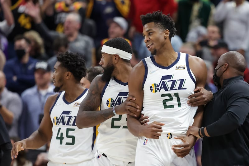 Utah Jazz forward Royce O’Neale pulls center Hassan Whiteside away after a scuffle during the game at Vivint Arena.