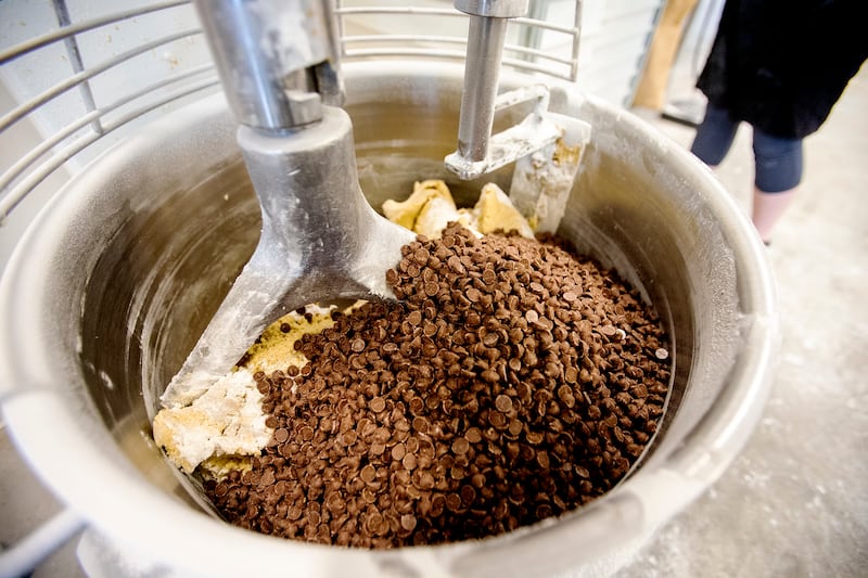Abbie McDougal works with the dough as she and other employees work at their Salt Lake City location on Monday, March 25, 2019.