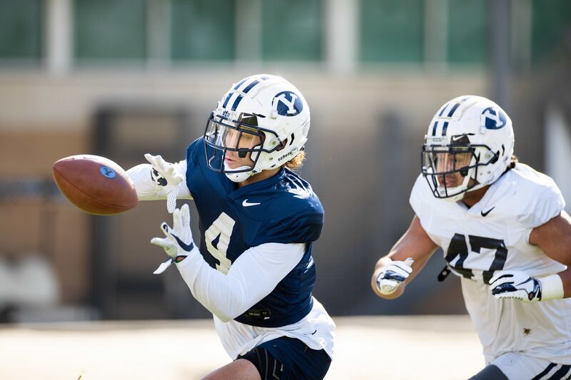 BYU running back Lopini Katoa catches a pass during spring camp in Provo last week.