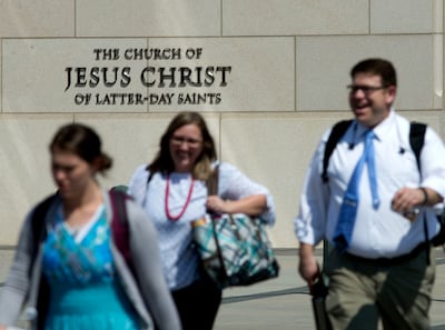 Pedestrians walk past the Church History Building in Salt Lake City on Thursday, August 16, 2018. The Church of Jesus Christ of Latter-day Saints has issued new name guidelines, dropping the term "Mormon" in most uses.