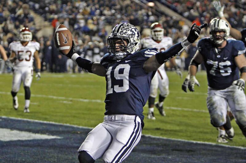 Brigham Young Cougars wide receiver Matt Marshall (19) celebrates after scoring as Brigham Young University plays New Mexico State University in football Saturday, Nov. 19, 2011, in Provo, Utah.