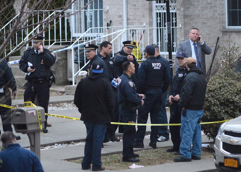 In this March 28, 2014, file photo, New York City Police gather at the scene as they investigate a triple shooting in the Rosebank section of the Staten Island borough of New York. During an 18-year period in which national incarceration rates climbed by
