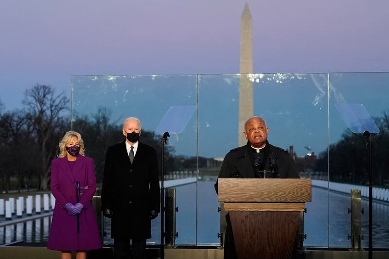President-elect Joe Biden and his wife, Jill, listen as Cardinal Wilton Gregory, archbishop of Washington, prays.