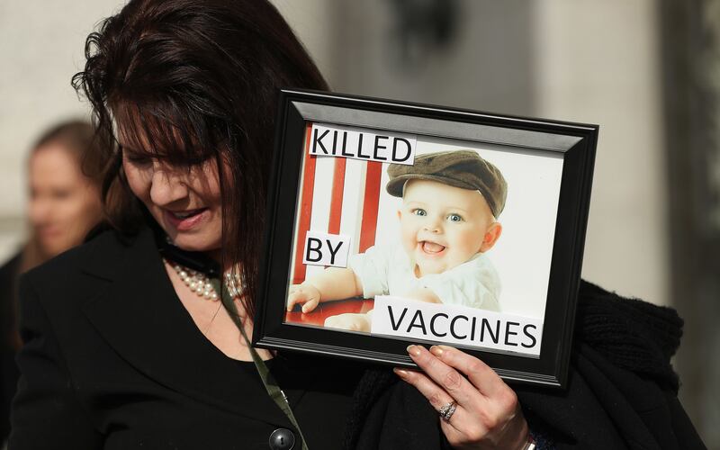 Blynn Simmos holds a photo of her grandson, Corbyn, as members of Your Health Freedom rally at the Capitol in Salt Lake City on Tuesday, March 5, 2019.