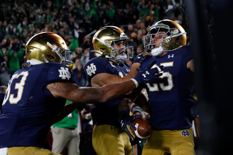 Notre Dame wide receiver Braden Lenzy (25) celebrates his 51-yard touchdown run with Chris Finke (10).