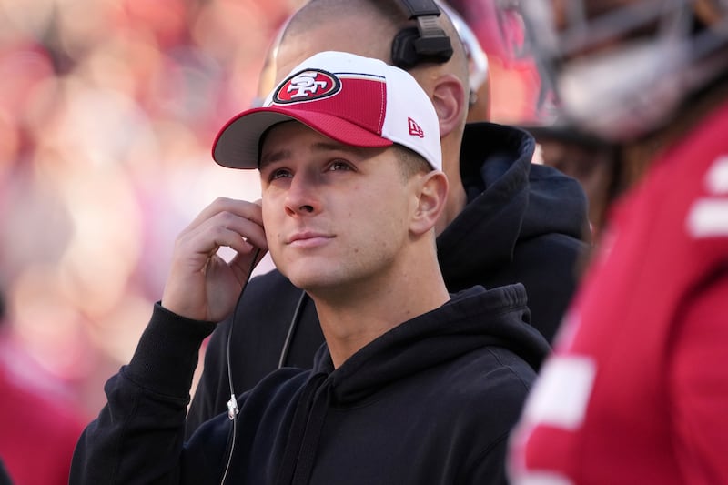 San Francisco 49ers quarterback Brock Purdy watches from the sideline during an NFL football game against Los Angeles Rams.