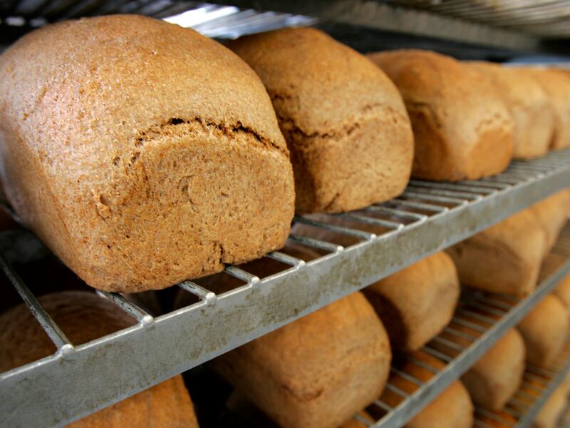 Fresh baked bread cools on racks at the Great Harvest Bread Company in Salt Lake City.