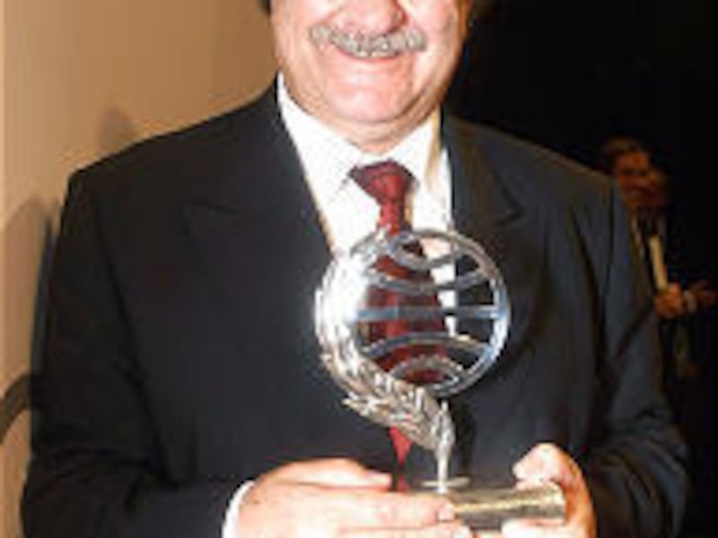 Chilean writer Antonio Skarmeta holds the Planeta publishing prize.
