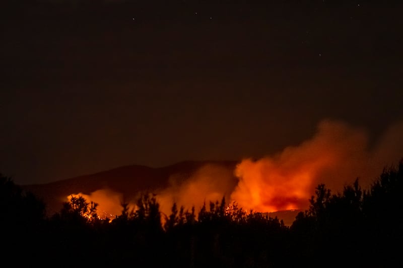 The Calf Canyon/Hermits Peak Fire burns south of Las Vegas, N.M.