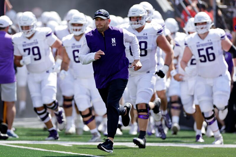 thwestern coach David Braun takes the field to face Rutgers Sunday, Sept. 3, 2023, in Piscataway, N.J.