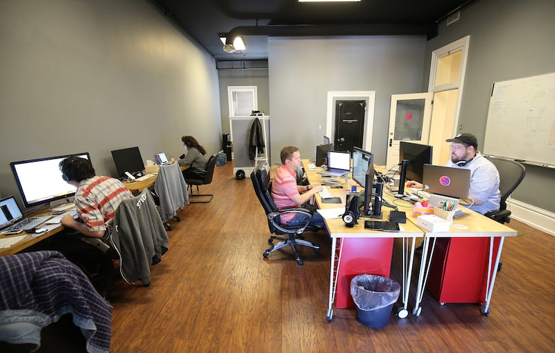 Cake employees work in the office in Provo on Tuesday, May 8, 2018.