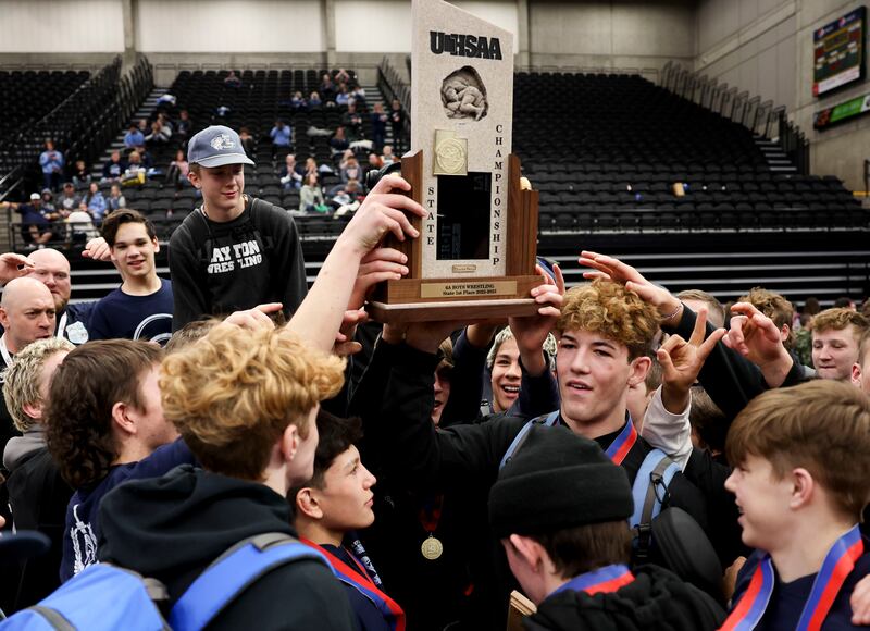 Layton celebrates its 6A wrestling championship win at UCCU Center in Orem on Thursday, Feb. 16, 2023.