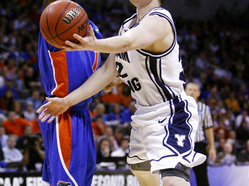 BYU's Jimmer Fredette, right, drives around Florida's Kenny Boynton in last year's NCAA game.