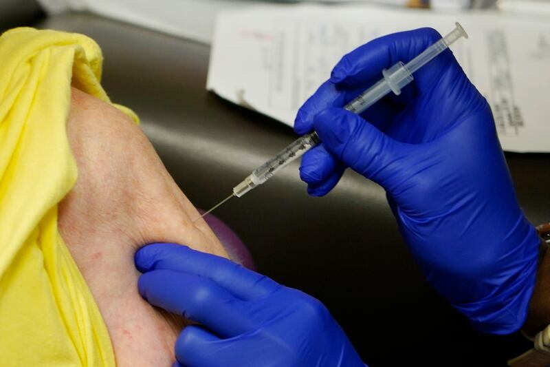 Linda Busby receives the Johnson & Johnson COVID-19 vaccine in Clarksdale, Miss.
