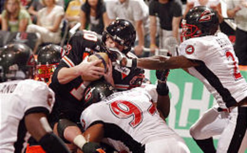 Utah Blaze QB Joe Germaine dives over the line in Friday's game.