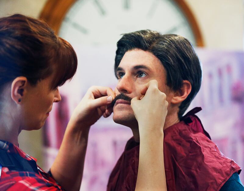 Marren Copeland, hair and makeup department head for Brigham Young University Broadcasting, applies a mustache to Matt Meese of Studio C in Provo on Thursday, Sept. 14, 2017.