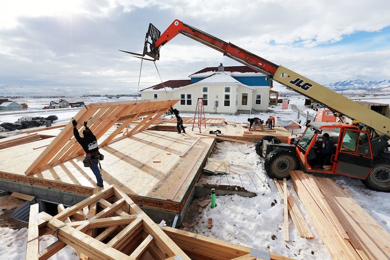 FILE - Workers from Dawson building systems put up a wall of a home being built in Daybreak on Friday, Feb. 3, 2017. As Salt Lake County leaders turn eyes southwest, strategizing on how to best master plan the last swath of undeveloped land in Utah's most