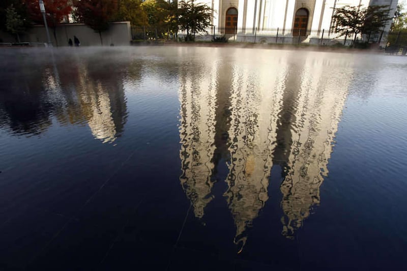 The Salt Lake Temple shines in the reflection pond in the Main Street Plaza in Salt Lake City Wednesday, Oct. 26, 2011.