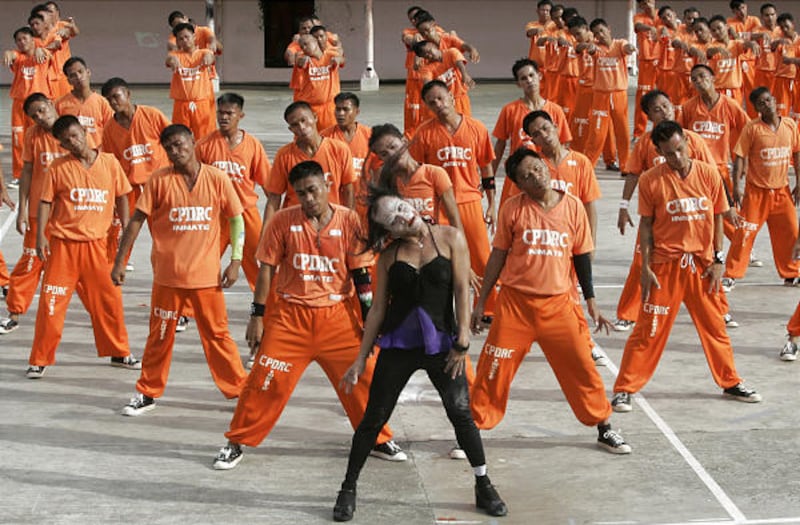 An inmate impersonates Michael Jackson as he leads a "Thriller" tribute in the central Philippines on Saturday.